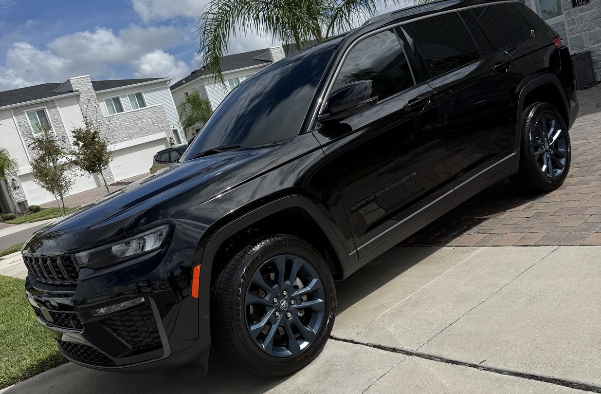 Black Jeep Grand Cherokee L glossy paint after car waxing and sealant in Davenport FL